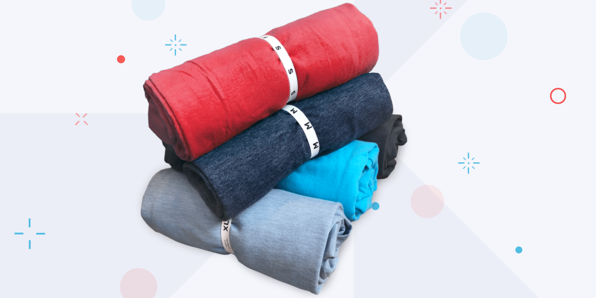 Event Packing rolled t-shirts that are sorted by size and labeled