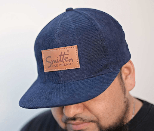 hat with branded leather detailing on the cap